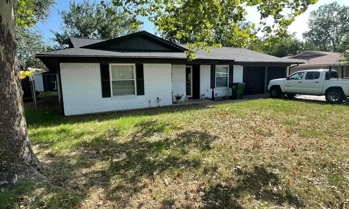 Professional roofing crew working on a residential roof in Bessemer City